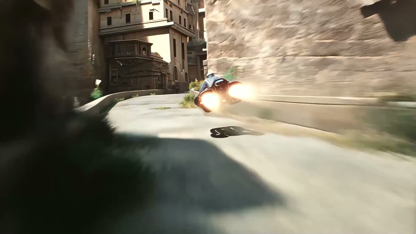 The speeder banks into a turn on a narrow street, kicking up dust